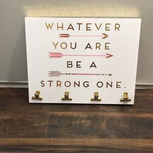 Wooden sign with hanging clips